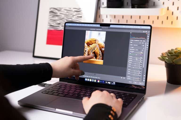 A person sitting in front of a laptop computer